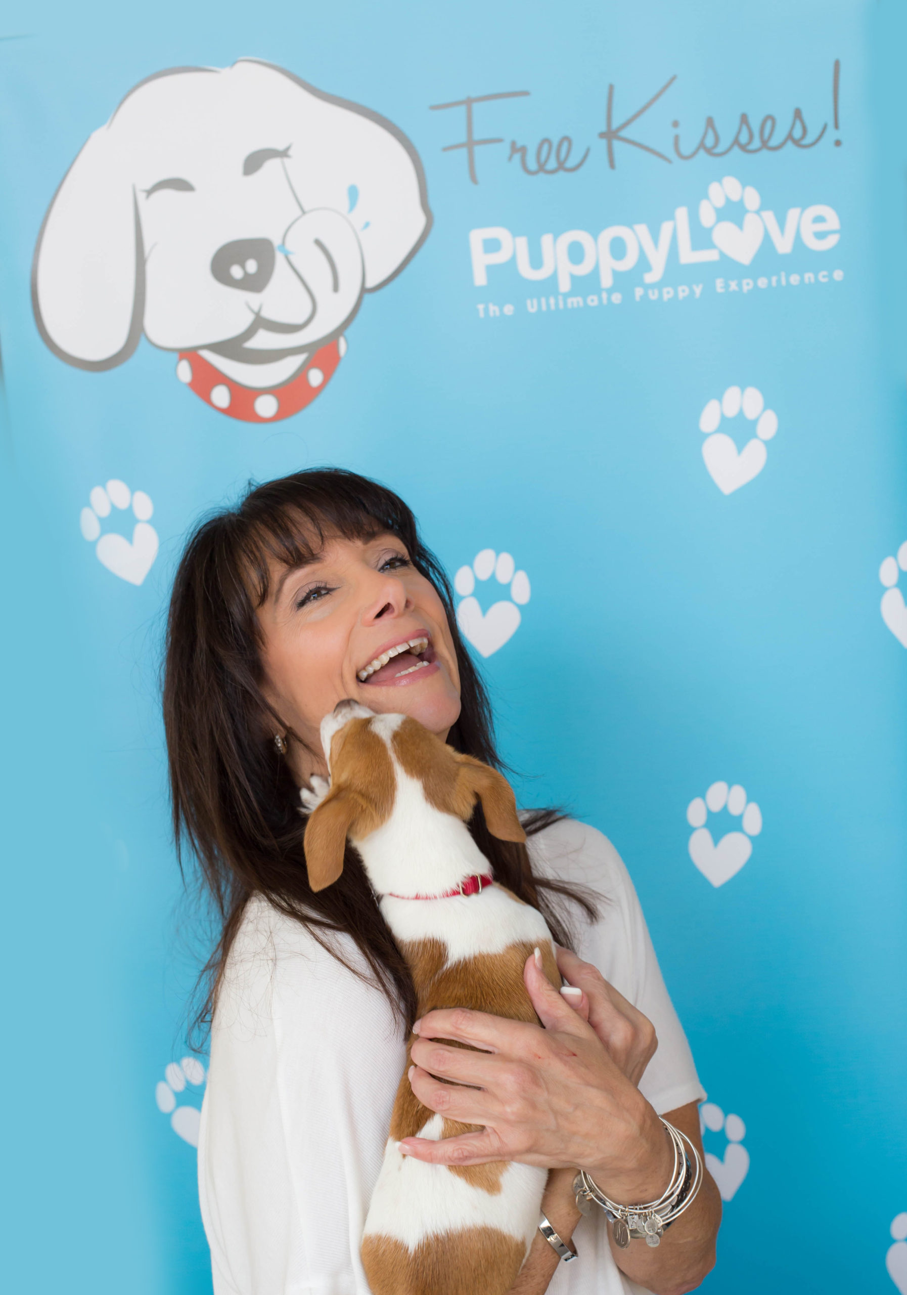 Founder of Puppy Love™ Northern California Sabrina Freed holding a puppy - learn more about our wellness activity for employees in Silicon Valley / Bay Area.