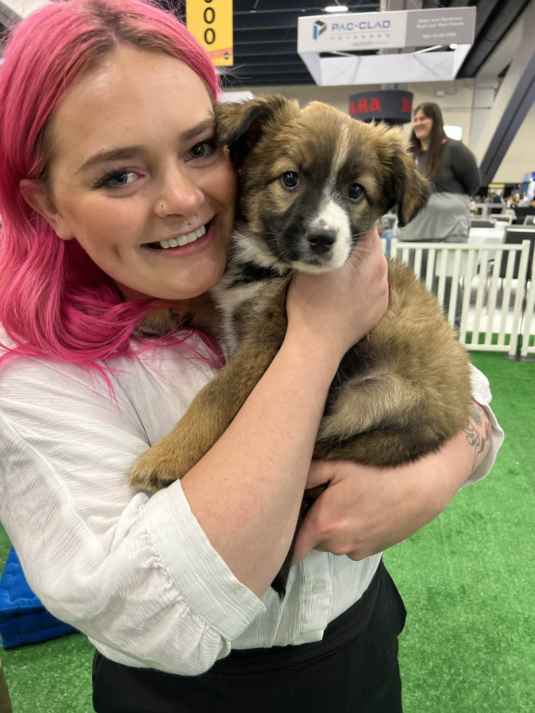 A Puppy Love puppy making the day of so many expo attendees!