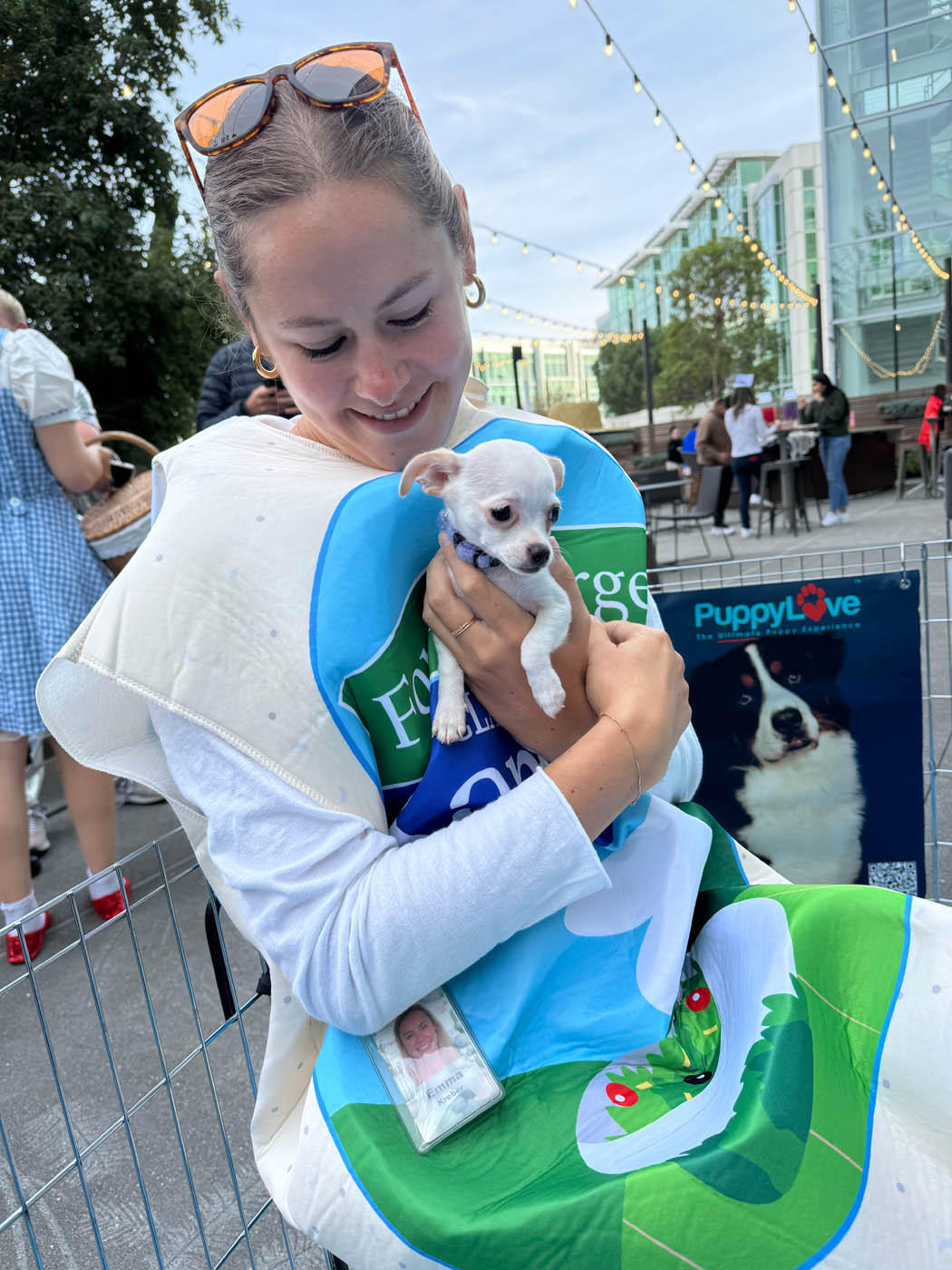 Puppy Love brings puppies and joy to google - girl in halloween costume holding a little pup.