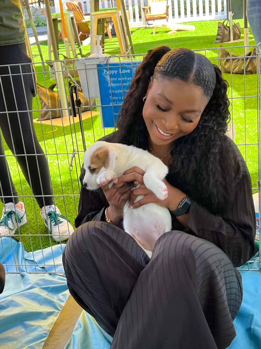 Ebay employee enjoying a corporate wellness program in Los Angeles to San Diego with a puppy.