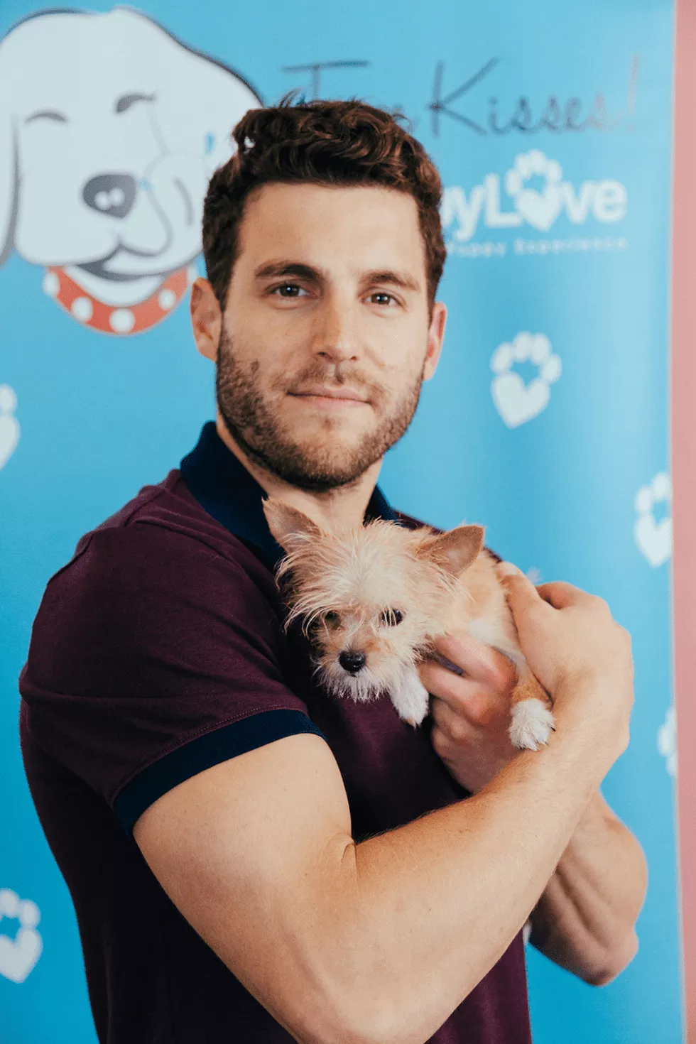 Man with a cute puppy at a puppy experience in Denver with Puppy Love.