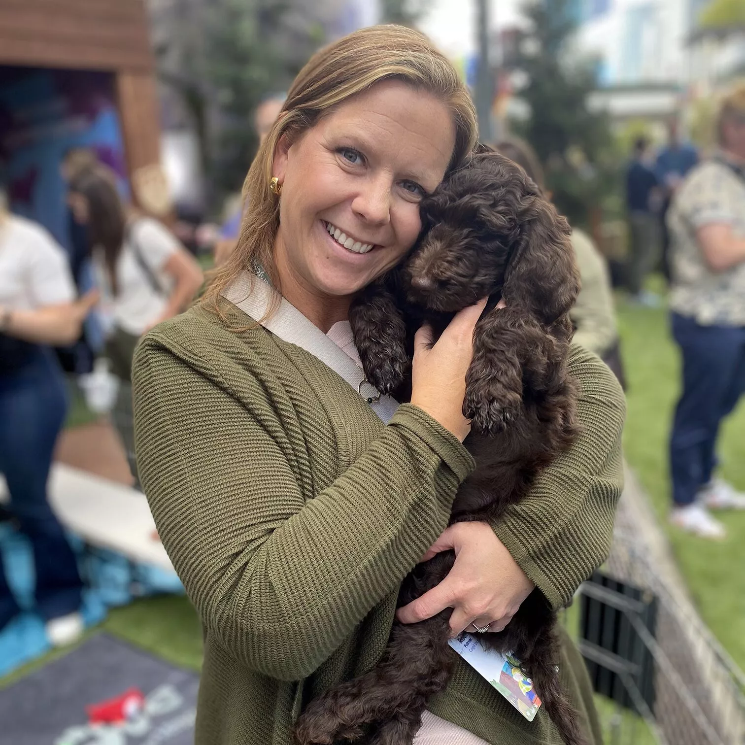 Accenture, Dreamforce, And Puppy Love™: Innovation With A Purpose 1 Dark brown, curly coated puppy.