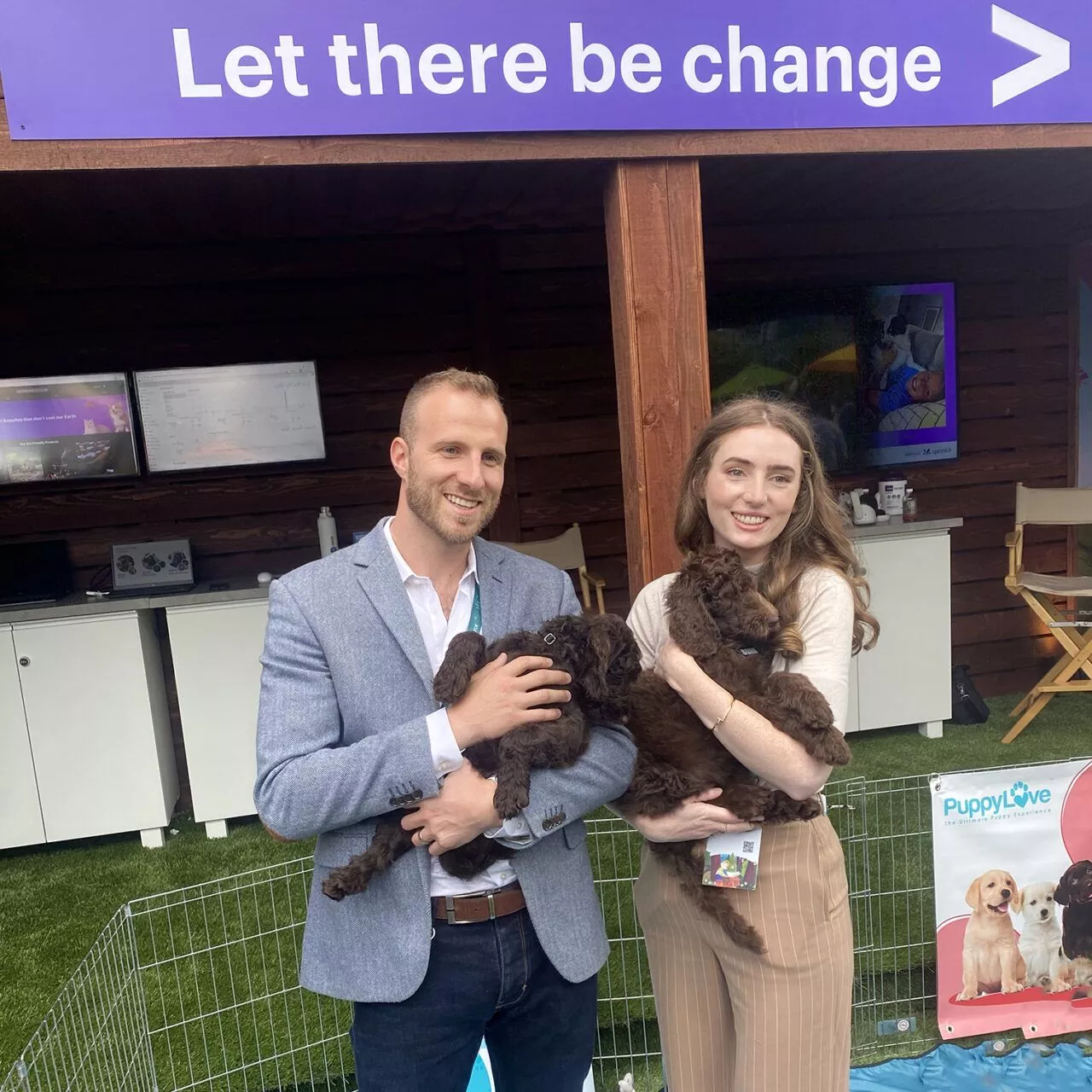 Accenture, Dreamforce, And Puppy Love™: Innovation With A Purpose 2 Women and man holding a dark brown puppy.