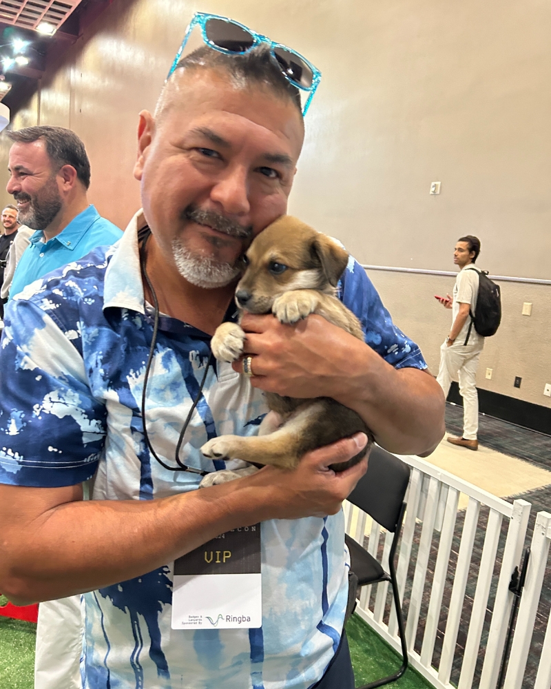 Attendee holding eight-week old cattle dog mix puppy