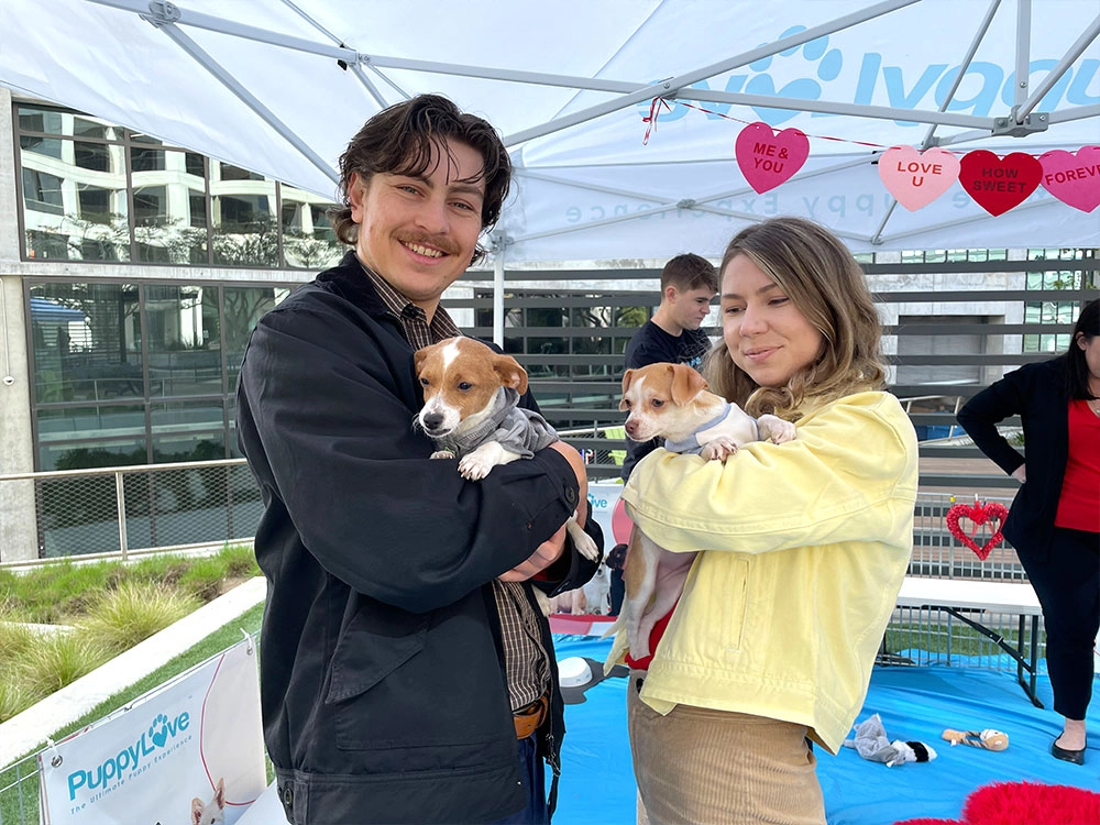 Want to hold a Puppy Love puppy like these people? Call Puppy Love today!